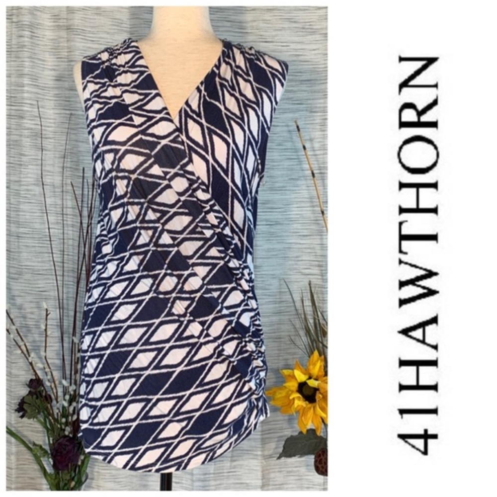 41 Hawthorn blue and white geometric diamond pattern sleeveless wrapped blouse.